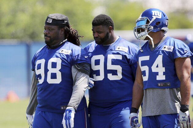 New York Giants defensive tackles Damon Harrison (98) and Johnathan Hankins (95) walk on the field with defensive end Olivier Vernon (54) during NFL football practice Monday, May 23, 2016 in East Rutherford, N.J. (AP Photo/Mel Evans)