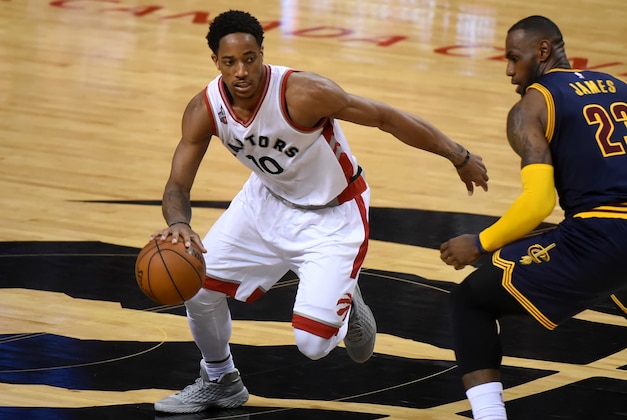 May 21, 2016; Toronto, Ontario, CAN; Toronto Raptors guard DeMar DeRozan (10) dribbles the ball past Cleveland Cavaliers forward LeBron James (23) in game three of the Eastern conference finals of the NBA Playoffs at Air Canada Centre. Mandatory Credit: Dan Hamilton-USA TODAY Sports