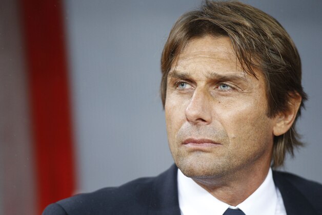 Italy's head coach Antonio Conte watches his team as they line up prior to the Euro 2016 soccer qualifying group H match between the Azerbaijan and Italy at the Olympic stadium in Baku, Azerbaijan, Saturday, Oct. 10, 2015. (AP Photo/Mindaugas Kulbis)
