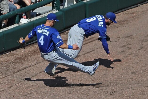 CHICAGO, IL - MAY 22:  Alex Gordon #4 and Mike Moustakas #8 of the Kansas City Royals collide going for a foul ball against the Chicago White Sox at U.S. Cellular Field on May 22, 2016 in Chicago, Illinois. The White Sox defeated the Royals 3-2.  (Photo by Jonathan Daniel/Getty Images)