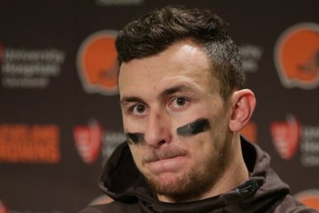 FILE - In this Dec. 20, 2015, file photo, Cleveland Browns quarterback Johnny Manziel speaks with media members following the team's 30-13 loss to the Seattle Seahawks in an NFL football game, in Seattle. Cleveland did not release Manziel on Wednesday, March 9, 2016, when the NFL began its new calendar year, a move that has been expected for weeks.   (AP Photo/Scott Eklund, File)