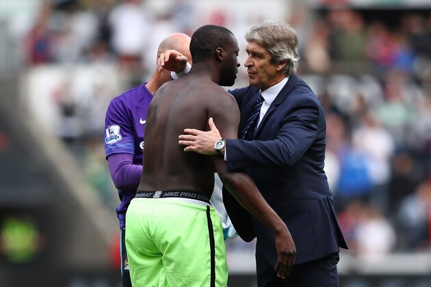 SWANSEA, WALES - MAY 15: Manuel Pellegrini, manager of Manchester City embraces Yaya Toure after the Barclays Premier League match between Swansea City and Manchester City at the Liberty Stadium on May 15, 2016 in Swansea, Wales.