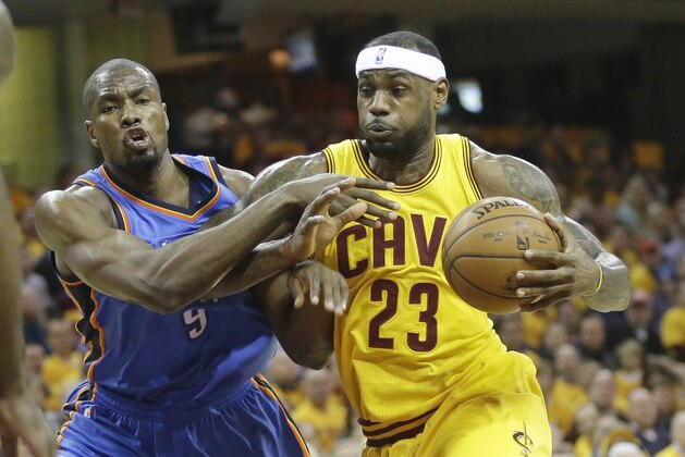 Cleveland Cavaliers' LeBron James (23) drives on Oklahoma City Thunder's Serge Ibaka, from Congo, in an NBA basketball game Sunday, Jan. 25, 2015, in Cleveland. (AP Photo/Mark Duncan)