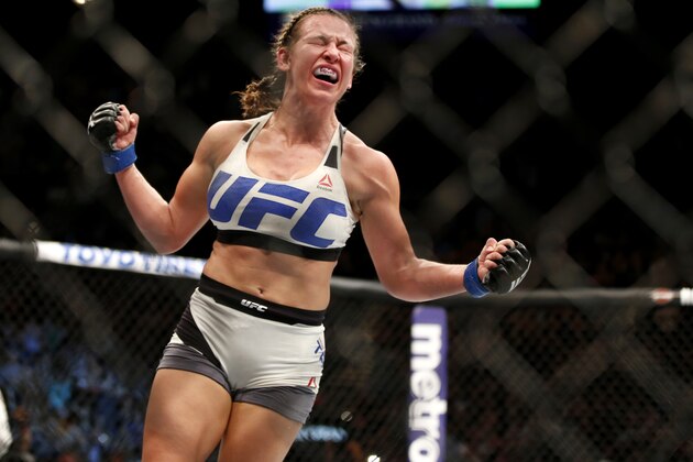Miesha Tate celebrates victory over Holly Holm in their UFC 196 women’s bantamweight mixed martial arts match Saturday, March 5, 2016, in Las Vegas. (AP Photo/Eric Jamison)