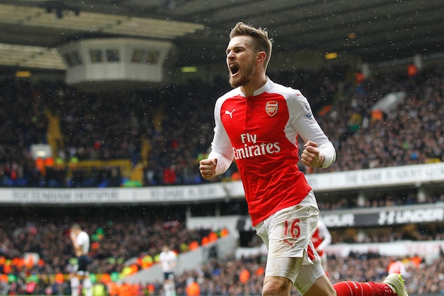Arsenal's Welsh midfielder Aaron Ramsey celebrates scoring his team's first goal during the English Premier League football match between Tottenham Hotspur and Arsenal at White Hart Lane in London, on March 5, 2016. / AFP / IKIMAGES / IKimages / RESTRICTED TO EDITORIAL USE. No use with unauthorized audio, video, data, fixture lists, club/league logos or 'live' services. Online in-match use limited to 45 images, no video emulation. No use in betting, games or single club/league/player publications.        (Photo credit should read IKIMAGES/AFP/Getty Images)