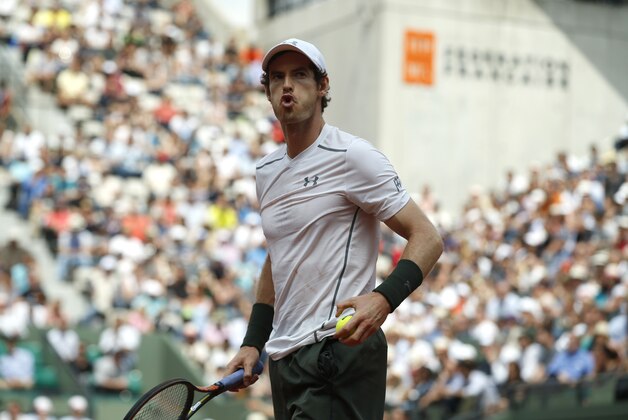 Britain's Andy Murray blows after defeating defeats Croatia's Ivo Karlovic during their third round match of the French Open tennis tournament at the Roland Garros stadium, Friday, May 27, 2016 in Paris. (AP Photo/Alastair Grant)