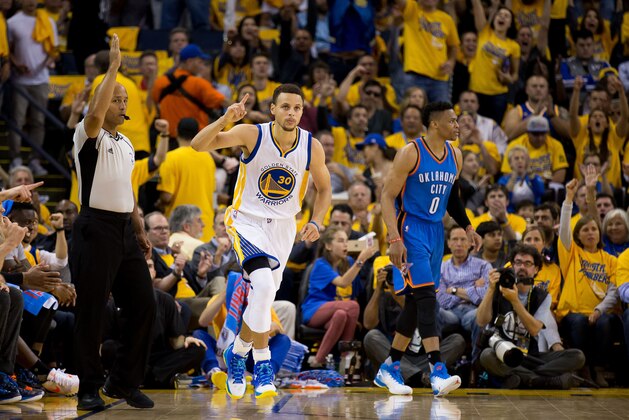 May 26, 2016; Oakland, CA, USA; Golden State Warriors guard Stephen Curry (30) reacts after a basket in front of Oklahoma City Thunder guard Russell Westbrook (0) during the third quarter in game five of the Western conference finals of the NBA Playoffs at Oracle Arena. Mandatory Credit: Kelley L Cox-USA TODAY Sports