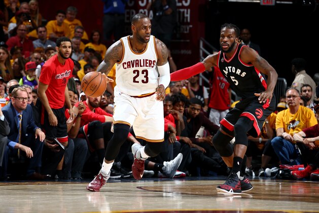 CLEVELAND, OH - MAY 25:  LeBron James #23 of the Cleveland Cavaliers handles the ball against DeMarre Carroll #5 of the Toronto Raptors in Game Five of the Eastern Conference Finals during the 2016 NBA Playoffs on May 25, 2016 at Quicken Loans Arena in Cleveland, Ohio.  NOTE TO USER: User expressly acknowledges and agrees that, by downloading and or using this Photograph, user is consenting to the terms and conditions of the Getty Images License Agreement. Mandatory Copyright Notice: Copyright 2016 NBAE (Photo by Nathaniel S. Butler/NBAE via Getty Images)