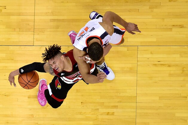 CHARLOTTESVILLE, VA - MARCH 05:  Damion Lee #0 of the Louisville Cardinals dribbles the ball as Malcolm Brogdon #15 of the Virginia Cavaliers defends in the second half during their game at John Paul Jones Arena on March 5, 2016 in Charlottesville, Virginia. The Virginia Cavaliers defeated the Louisville Cardinals 68-46.  (Photo by Patrick McDermott/Getty Images)