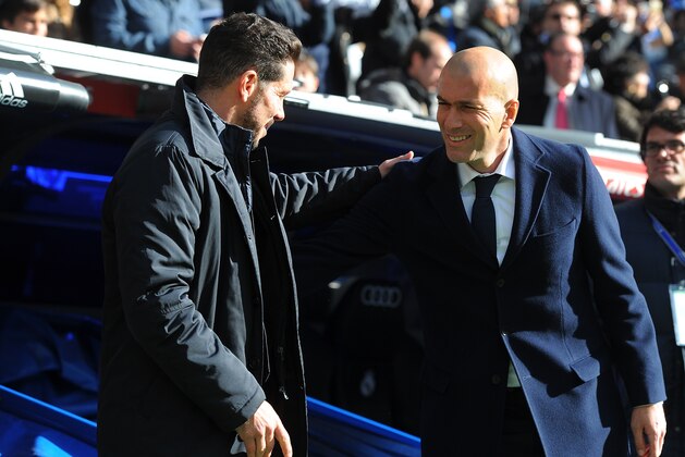 MADRID, SPAIN - FEBRUARY 27:  Manager Diego Simeone of Club Atletico de Madrid greets Real Madrid manager Zinedine Zidane during the La Liga match between Real Madrid CF and Club Atletico de Madrid at Estadio Santiago Bernabeu on February 27, 2016 in Madrid, Spain.  (Photo by Denis Doyle/Getty Images)
