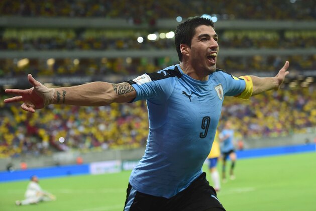 Uruguay's Luis Suarez celebrates after scoring against Brazil during their Russia 2018 FIFA World Cup South American Qualifiers' football match, in Recife, northeastern Brazil, on March 25, 2016.   AFP PHOTO / CHRISTOPHE SIMON / AFP / CHRISTOPHE SIMON        (Photo credit should read CHRISTOPHE SIMON/AFP/Getty Images)