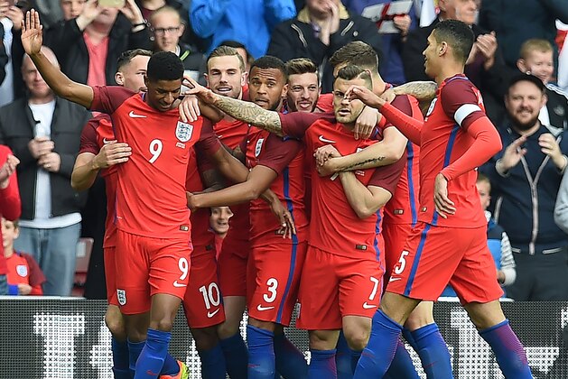 England's striker Marcus Rashford (2nd L) celebrates after scoring his team's first goal during the International friendly football match between England and Australia at the Stadium of Light in Sunderland, north east England, on May 27, 2016. / AFP / PAUL ELLIS / NOT FOR MARKETING OR ADVERTISING USE / RESTRICTED TO EDITORIAL USE        (Photo credit should read PAUL ELLIS/AFP/Getty Images)