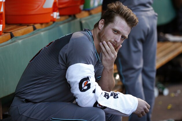 Arizona Diamondbacks starting pitcher Shelby Miller sits in the dugout during the first inning of a baseball game against the Pittsburgh Pirates in Pittsburgh, Tuesday, May 24, 2016. The Pirates won 12-1 with Miller taking the loss. (AP Photo/Gene J. Puskar)