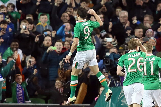 Republic of Ireland's striker Shane Long celebrates scoring an equalising goal for 1-1 during the international friendly football match between Republic of Ireland and Slovakia at Aviva Stadium in Dublin on March 29, 2016. / AFP / PAUL FAITH        (Photo credit should read PAUL FAITH/AFP/Getty Images)