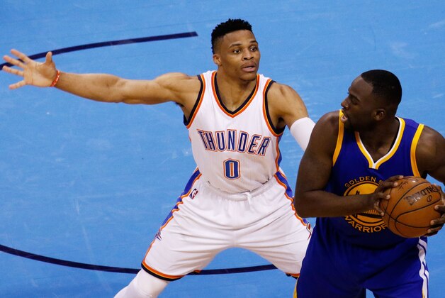 OKLAHOMA CITY, OK - MAY 24:  Draymond Green #23 of the Golden State Warriors drives against Russell Westbrook #0 of the Oklahoma City Thunder in the second half in game four of the Western Conference Finals during the 2016 NBA Playoffs at Chesapeake Energy Arena on May 24, 2016 in Oklahoma City, Oklahoma. NOTE TO USER: User expressly acknowledges and agrees that, by downloading and or using this photograph, User is consenting to the terms and conditions of the Getty Images License Agreement.  (Photo by J Pat Carter/Getty Images)