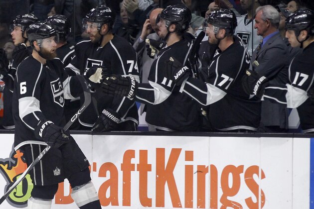 Los Angeles Kings defenseman Jake Muzzin, left, is congratulated by teammates after scoring against the Washington Capitals during the first period of an NHL hockey game in Los Angeles, Wednesday, March 9, 2016. (AP Photo/Alex Gallardo)