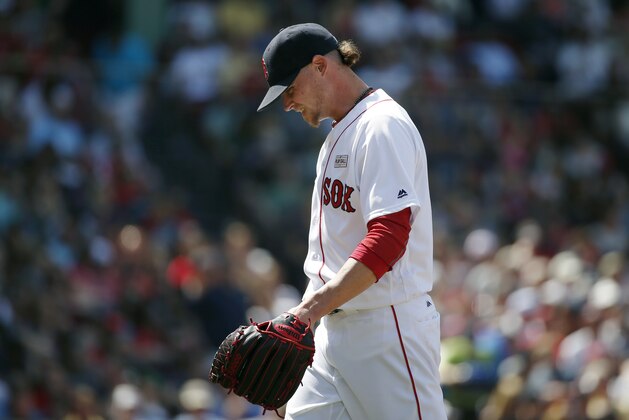Boston Red Sox's Clay Buchholz walks to the dug out after pitching during the fourth inning of a baseball game against the Houston Astros in Boston, Saturday, May 14, 2016. (AP Photo/Michael Dwyer)