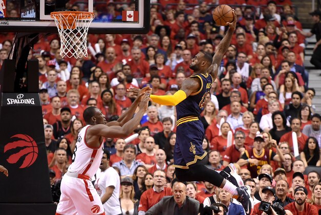 May 23, 2016; Toronto, Ontario, CAN;  Cleveland Cavaliers forward LeBron James (23) goes up to dunk for a basket over Toronto Raptors center Bismack Biyombo (8) in the second quarter in game four of the Eastern conference finals of the NBA Playoffs at Air Canada Centre. Mandatory Credit: Dan Hamilton-USA TODAY Sports