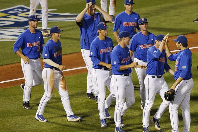 Florida pitcher Alex Faedo, far right, celebrates with his team after winning  a Southeastern Conference NCAA college baseball tournament game against Mississippi State, Friday, May 27, 2016, in Hoover, Ala. (AP Photo/Brynn Anderson)