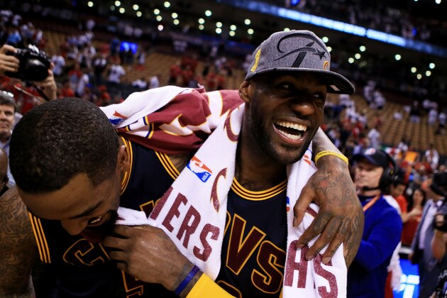 TORONTO, ON - MAY 27:  LeBron James #23 and J.R. Smith #5 of the Cleveland Cavaliers celebrate their 113 to 87 win over the Toronto Raptors in game six of the Eastern Conference Finals during the 2016 NBA Playoffs at Air Canada Centre on May 27, 2016 in Toronto, Canada. NOTE TO USER: User expressly acknowledges and agrees that, by downloading and or using this photograph, User is consenting to the terms and conditions of the Getty Images License Agreement.  (Photo by Vaughn Ridley/Getty Images)