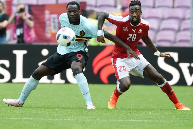 Belgium's forward Romelu Lukaku (L) vies with Switzerland's defender Johan Djourou (R) during the friendly football match between Switzerland and Belgium on May 28, 2016, in Geneva.  / AFP / PHILIPPE DESMAZES        (Photo credit should read PHILIPPE DESMAZES/AFP/Getty Images)