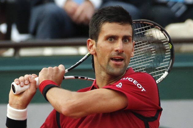 Serbia's Novak Djokovic returns in the third round match of the French Open tennis tournament against Britain’s Aljaz Bedene at the Roland Garros stadium in Paris, France, Saturday, May 28, 2016. (AP Photo/Alastair Grant)
