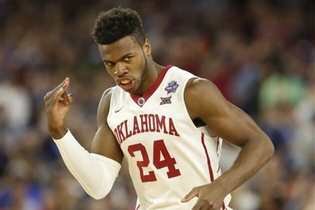 Oklahoma's Buddy Hield reacts to a three point basket during the first half of the NCAA Final Four tournament college basketball semifinal game against Villanova, Saturday, April 2, 2016, in Houston. (AP Photo/Eric Gay)