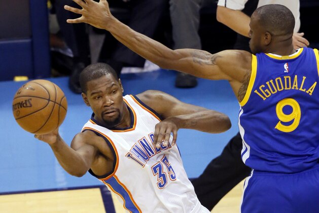 Oklahoma City Thunder forward Kevin Durant (35) passes around Golden State Warriors forward Andre Iguodala (9) during the first half in Game 4 of the NBA basketball Western Conference finals in Oklahoma City, Tuesday, May 24,, 2016. (AP Photo/Sue Ogrocki) Oklahoma City Thunder forward Kevin Durant (35) passes around Golden State Warriors forward Andre Iguodala (9) during the first half in Game 4 of the NBA basketball Western Conference finals in Oklahoma City, Tuesday, May 24,, 2016. (AP Photo/Sue Ogrocki)