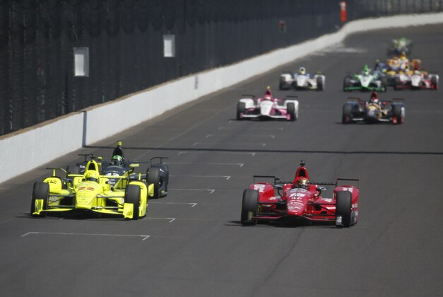 May 27, 2016; Indianapolis, IN, USA; Verizon Indy Car drivers Simon Pagenaud (22) and Graham Rahal (15) drive side by side down the front straightaway during Carb Day for the Indianapolis 500 at Indianapolis Motor Speedway. Mandatory Credit: Brian Spurlock-USA TODAY Sports