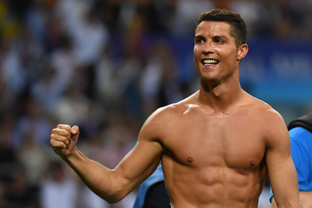 Real Madrid's Portuguese forward Cristiano Ronaldo celebrates after Real Madrid won the UEFA Champions League final football match over Atletico Madrid at San Siro Stadium in Milan, on May 28, 2016. / AFP / GERARD JULIEN        (Photo credit should read GERARD JULIEN/AFP/Getty Images)