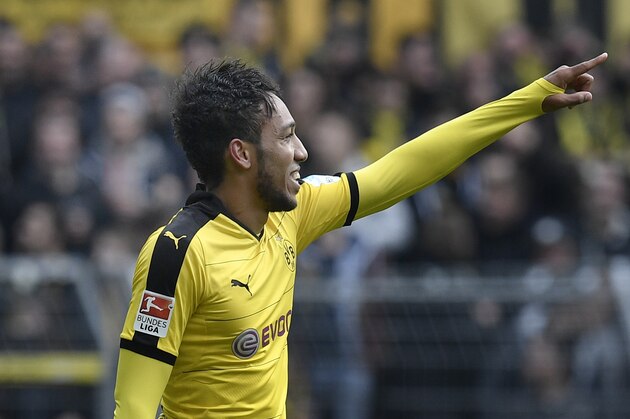 Dortmund's Pierre-Emerick Aubameyang celebrates after scoring his second goal during the German Bundesliga soccer match between Borussia Dortmund and VfL Wolfsburg in Dortmund, Germany, Saturday, April 30, 2016. (AP Photo/Martin Meissner)