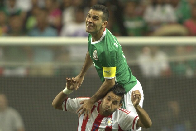 Rafael Marquez of Mexico (R) vies for the ball with Jorge Benitez (L) of Paraguay during the friendly match between the Mexican national team and Paraguay national team at the Georgia Dome in Atlanta, Georgia on May 28, 2016. / AFP / VICTOR STRAFFON        (Photo credit should read VICTOR STRAFFON/AFP/Getty Images)