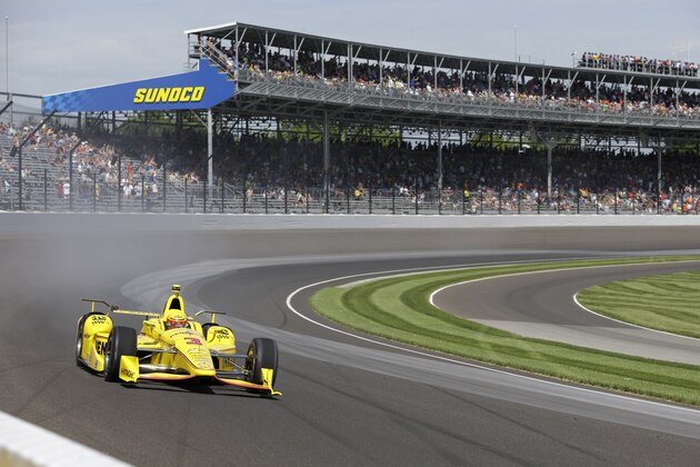 Helio Castroneves, of Brazil, drives through turn one during the final practice session for the Indianapolis 500 auto race at Indianapolis Motor Speedway in Indianapolis, Friday, May 27, 2016. (AP Photo/Michael Conroy)