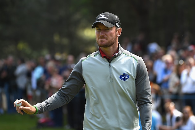 VIRGINIA WATER, ENGLAND - MAY 29:  Chris Wood of England acknowledges the crowd during day four of the BMW PGA Championship at Wentworth on May 29, 2016 in Virginia Water, England.  (Photo by Ross Kinnaird/Getty Images)