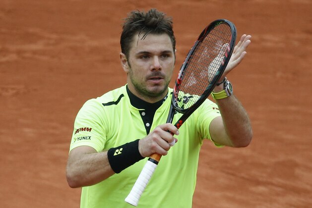 Switzerland's Stan Wawrinka celebrates winning the fourth round match of the French Open tennis tournament against Serbia's Viktor Troicki at the Roland Garros stadium in Paris, France, Sunday, May 29, 2016. (AP Photo/Alastair Grant)