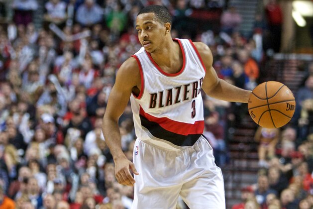 Portland Trail Blazers guard C.J. McCollum dribbles the ball during the second half of an NBA basketball game in Portland, Ore., Wednesday, Dec. 30, 2015. The Trail Blazers won the game 110-103. (AP Photo/Craig Mitchelldyer)