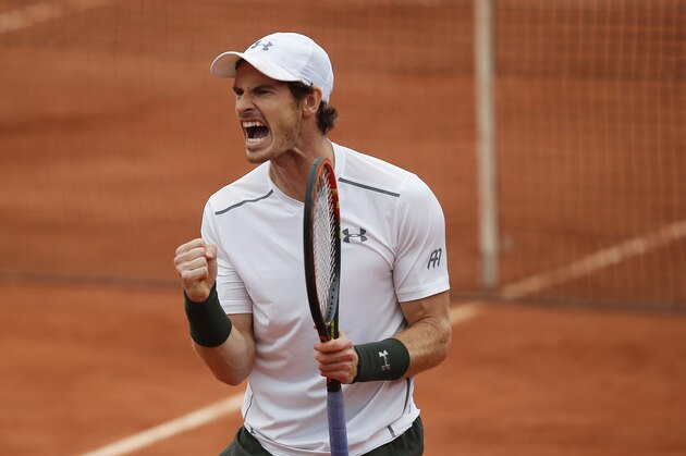 Britain's Andy Murray clenches his fist after scoring a point in the fourth round match of the French Open tennis tournament against John Isner of the U.S. at the Roland Garros stadium in Paris, France, Sunday, May 29, 2016. (AP Photo/Michel Euler)