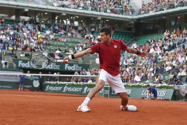 Serbia's Novak Djokovic returns in the third round match of the French Open tennis tournament against Britain’s Aljaz Bedene at the Roland Garros stadium in Paris, France, Saturday, May 28, 2016. (AP Photo/Alastair Grant)