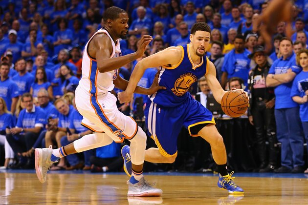 OKLAHOMA CITY, OK - MAY 28:  Klay Thompson #11 of the Golden State Warriors drives against Kevin Durant #35 of the Oklahoma City Thunder during the fourth quarter in game six of the Western Conference Finals during the 2016 NBA Playoffs at Chesapeake Energy Arena on May 28, 2016 in Oklahoma City, Oklahoma. NOTE TO USER: User expressly acknowledges and agrees that, by downloading and or using this photograph, User is consenting to the terms and conditions of the Getty Images License Agreement.  (Photo by Maddie Meyer/Getty Images)