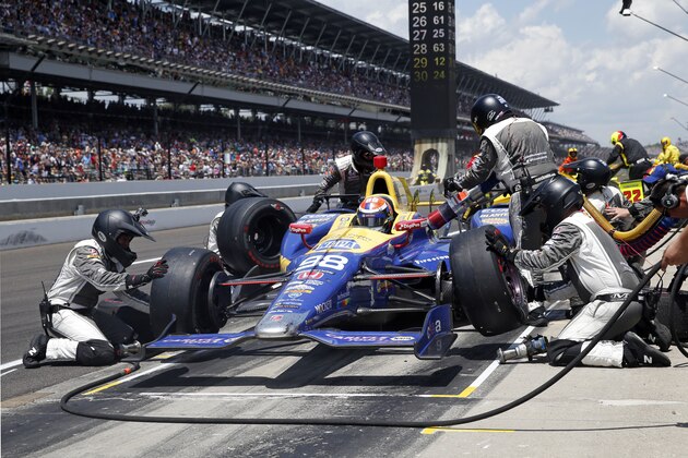 The car driven by Alexander Rossi is serviced during a pit stop in the 100th running of the Indianapolis 500 auto race at Indianapolis Motor Speedway in Indianapolis, Sunday, May 29, 2016. (AP Photo/Rob Baker)