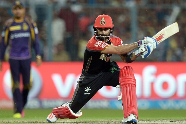Royal Challengers Bangalore captain Virat Kohli plays a shot during the 2016 Indian Premier League (IPL) Twenty20 cricket match between Kolkata Knight Riders and Royal Challengers Bangalore at the Eden Gardens Cricket Stadium in Kolkata on May 16, 2016.  ----IMAGE RESTRICTED TO EDITORIAL USE - STRICTLY NO COMMERCIAL USE----- / GETTYOUT' / AFP / Dibyangshu SARKAR        (Photo credit should read DIBYANGSHU SARKAR/AFP/Getty Images)