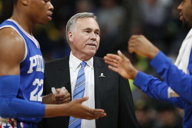 Philadelphia 76ers assistant coach Mike D'Antoni in the first half of an NBA basketball game Wednesday, March 23, 2016, in Denver. (AP Photo/David Zalubowski)