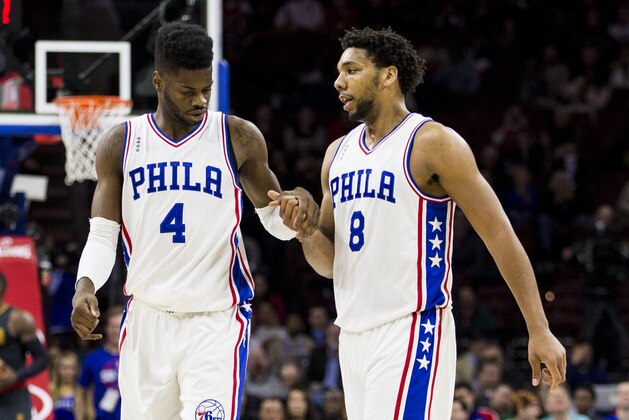Philadelphia 76ers' Nerlens Noel, left, interacts with Jahlil Okafor, right, during the first half of an NBA basketball game against the Atlanta Hawks, Thursday, Jan. 7, 2016, in Philadelphia. The Hawks won 126-98. (AP Photo/Chris Szagola)