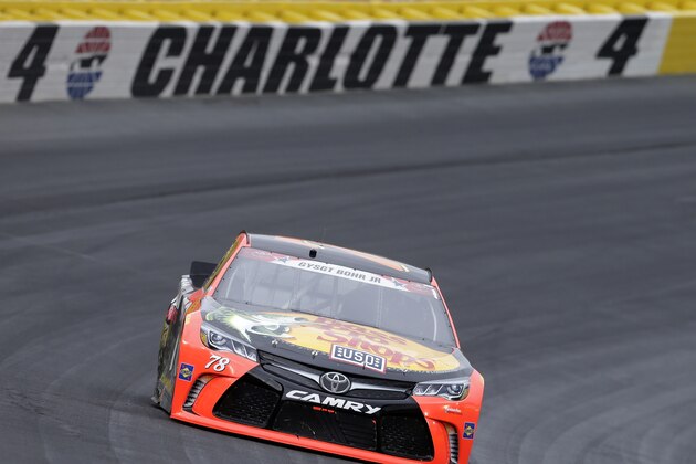 Martin Truex Jr races out of Turn 4 during the NASCAR Sprint Cup series auto race at Charlotte Motor Speedway in Concord, N.C., Sunday, May 29, 2016. (AP Photo/Chuck Burton)