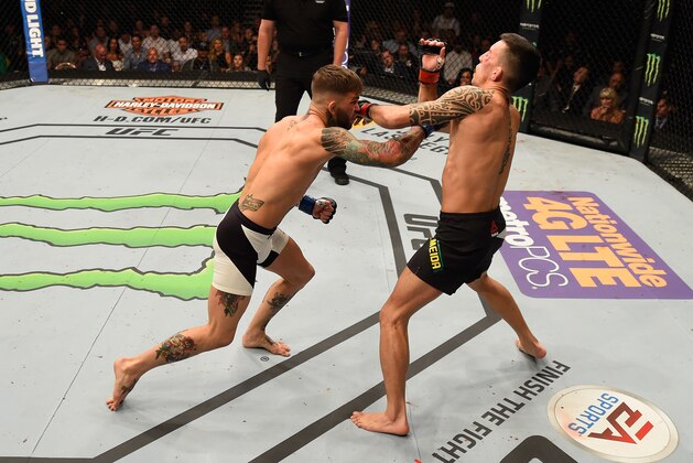 LAS VEGAS, NV - MAY 29: (L-R) Cody Garbrandt punches Thomas Almeida of Brazil in their bantamweight bout during the UFC Fight Night event inside the Mandalay Bay Events Center on May 29, 2016 in Las Vegas, Nevada.  (Photo by Josh Hedges/Zuffa LLC/Zuffa LLC via Getty Images)