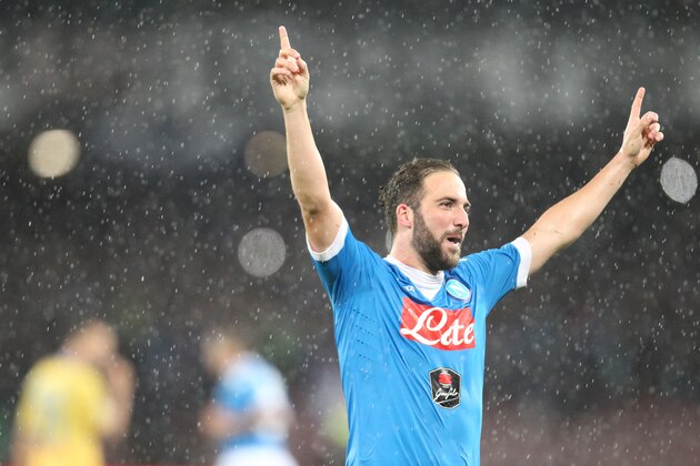 Napoli's Argentinian-French forward Gonzalo Higuain celebrates after scoring his 36th goal in the season, breaking the Italian record of 35 scores established in 1949-50 season by Ac Milan's Swedish forward Gunnar Nordahl, during the Italian Serie A football match SSC Napoli vs Frosinone Calcio on May 14 2016 at the San Paolo stadium in Naples. / AFP / CARLO HERMANN        (Photo credit should read CARLO HERMANN/AFP/Getty Images)