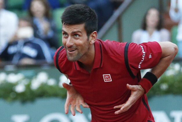 Serbia's Novak Djokovic celebrates winning his third round match of the French Open tennis tournament against Britain’s Aljaz Bedene at the Roland Garros stadium in Paris, France, Saturday, May 28, 2016. (AP Photo/Alastair Grant)