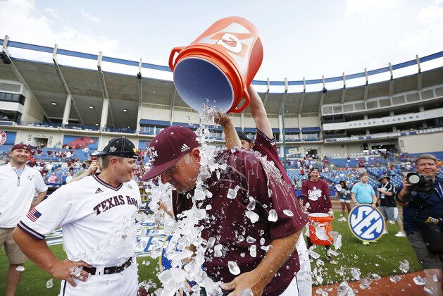 Texas A&M's head coach Rob Childress is dunked by his players to celebrate their win against Florida during the Southeastern Conference NCAA college baseball championship game at the Hoover Met, Sunday, May 29, 2016, in Hoover, Ala. Texas A&M won 12-5. (AP Photo/Brynn Anderson)