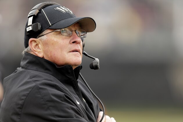 Wake Forest head coach Jim Grobe looks at the scoreboard as his team plays Florida State in the second half of an NCAA college football game in Winston-Salem, N.C., Saturday, Nov. 9, 2013. Florida State won 59-3. (AP Photo/Nell Redmond)