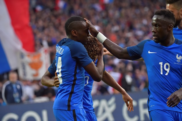 France's midfielder Blaise Matuidi (L) celebrates with his teammates forward Kingsley Coman (rear L) and defender Bacary Sagna (R) after scoring a goal during the International friendly football match between France and Cameroon at the Beaujoire stadium, in Nantes, western France, on May 30, 2016 as part of the French team's preparation for the upcoming Euro 2016 European football championships. / AFP / LOIC VENANCE        (Photo credit should read LOIC VENANCE/AFP/Getty Images)